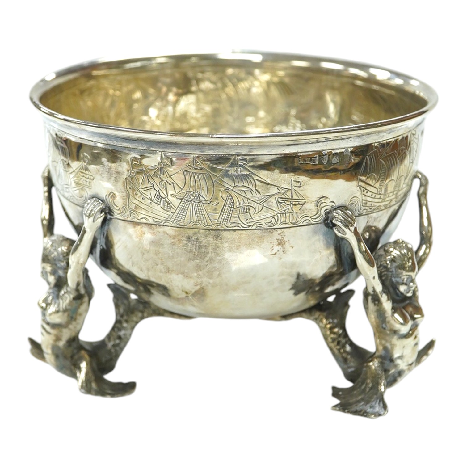 A George V Hanau silver bowl, import marks for Berthold Muller, with three Mermaid supports, London, 1912, diameter 13cm, 11.8oz. Condition - poor